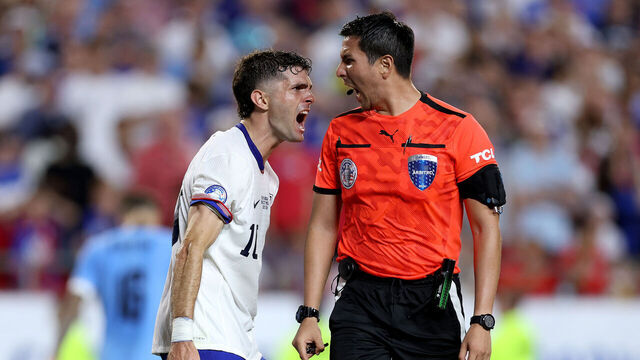 KANSAS CITY, MISSOURI - JULY 01: Christian Pulisic of United States argues with Referee Kevin Ortega during the CONMEBOL Copa America 2024 Group C match between United States and Uruguay at GEHA Field at Arrowhead Stadium on July 01, 2024 in Kansas City, Missouri.