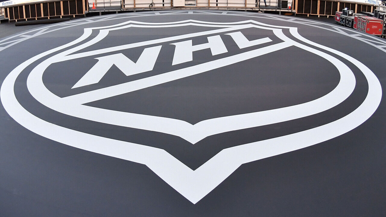 EDMONTON, CANADA - OCTOBER 25: A view of the NHL logo on a stage at Commonwealth Stadium in advance of the 2023 Tim Hortons NHL Heritage Classic on October 25, 2023, in Edmonton, Alberta, Canada.