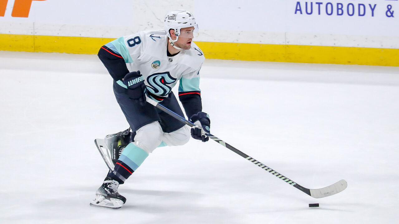 WINNIPEG, CANADA - APRIL 16: Brian Dumoulin #8 of the Seattle Kraken plays the puck down the ice during second period action against the Winnipeg Jets at the Canada Life Centre on April 16, 2024 in Winnipeg, Manitoba, Canada. The Jets defeated the Kraken 4-3.