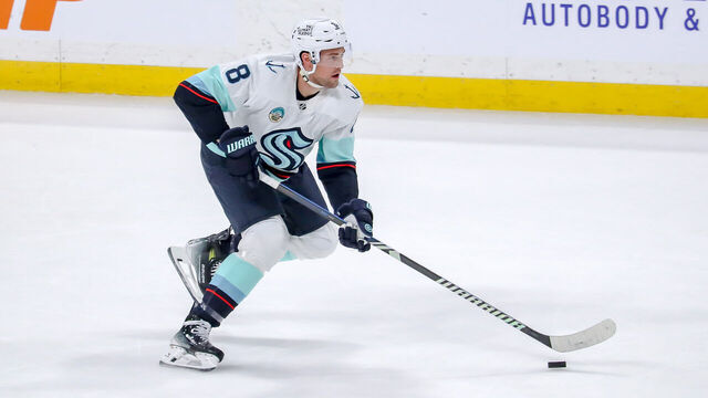 WINNIPEG, CANADA - APRIL 16: Brian Dumoulin #8 of the Seattle Kraken plays the puck down the ice during second period action against the Winnipeg Jets at the Canada Life Centre on April 16, 2024 in Winnipeg, Manitoba, Canada. The Jets defeated the Kraken 4-3.