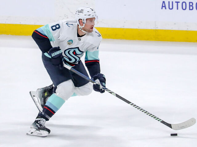 WINNIPEG, CANADA - APRIL 16: Brian Dumoulin #8 of the Seattle Kraken plays the puck down the ice during second period action against the Winnipeg Jets at the Canada Life Centre on April 16, 2024 in Winnipeg, Manitoba, Canada. The Jets defeated the Kraken 4-3.