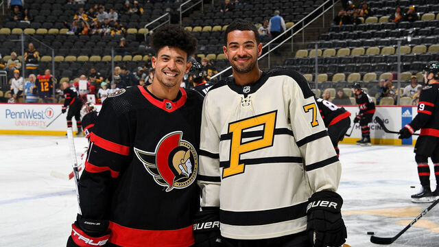 PITTSBURGH, PA - JANUARY 20: Brothers Mathieu Joseph #21 of the Ottawa Senators and Pierre-Olivier Joseph #73 of the Pittsburgh Penguins pose for a photo before the game at PPG PAINTS Arena on January 20, 2023 in Pittsburgh, Pennsylvania.