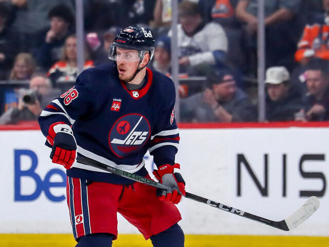 WINNIPEG, CANADA - MARCH 26: Nate Schmidt #88 of the Winnipeg Jets keeps an eye on the play during first period action against the Edmonton Oilers at the Canada Life Centre on March 26, 2024 in Winnipeg, Manitoba, Canada. The Oilers defeated the Jets 4-3 in overtime.