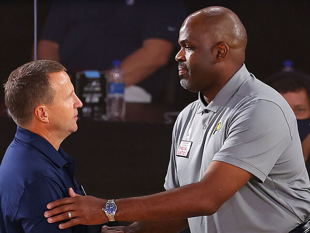 LAKE BUENA VISTA, FLORIDA - AUGUST 03: Nate McMillan of the Indiana Pacers and Scott Brooks of the Washington Wizards shake hands after the game at Visa Athletic Center at ESPN Wide World Of Sports Complex on August 03, 2020 in Lake Buena Vista, Florida.