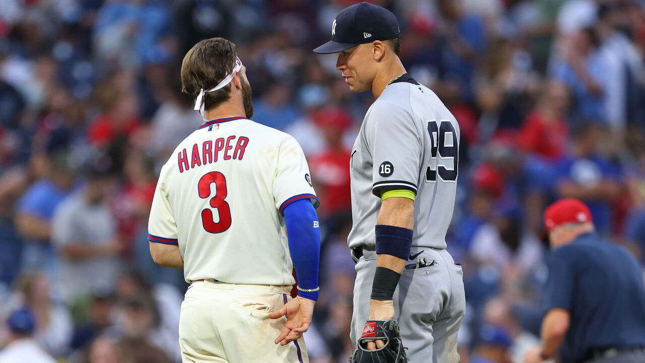 PHILADELPHIA, PA - JUNE 12: Bryce Harper #3 of the Philadelphia Phillies talks with Aaron Judge #99 of the New York Yankees during a game at Citizens Bank Park on June 12, 2021 in Philadelphia, Pennsylvania.