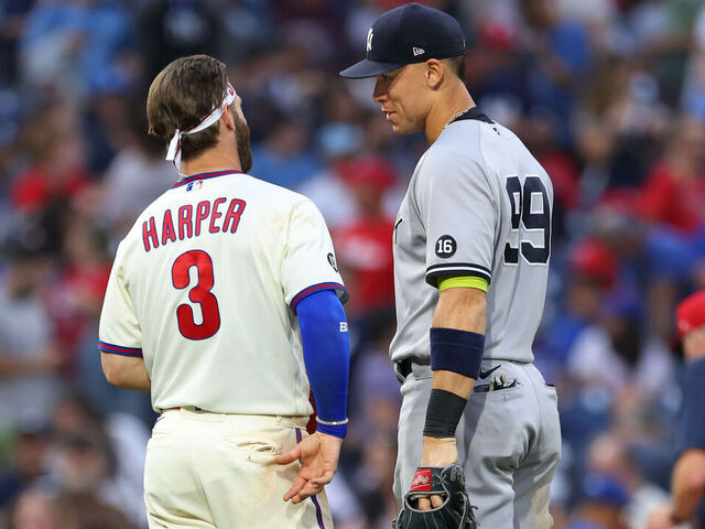 PHILADELPHIA, PA - JUNE 12: Bryce Harper #3 of the Philadelphia Phillies talks with Aaron Judge #99 of the New York Yankees during a game at Citizens Bank Park on June 12, 2021 in Philadelphia, Pennsylvania.