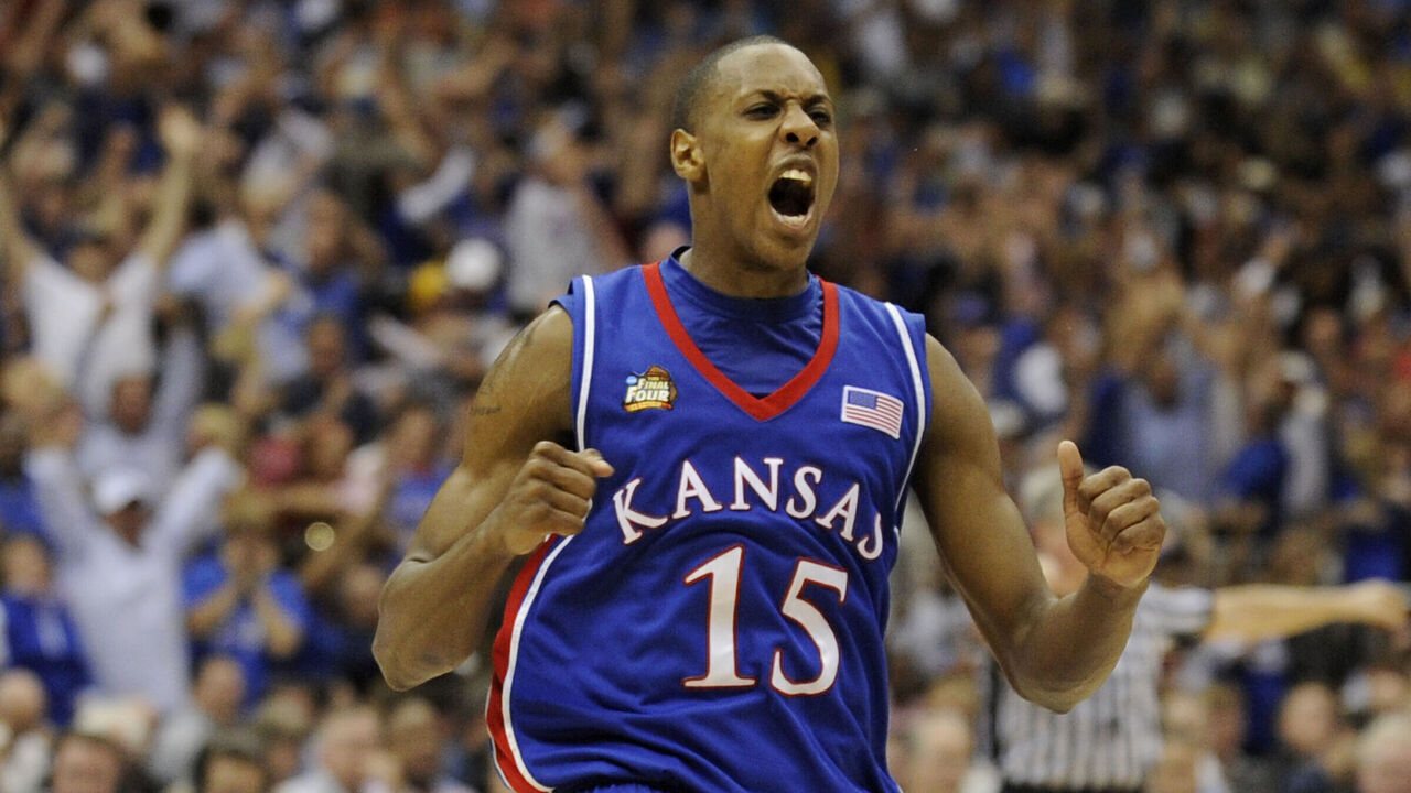 07 APR 2008: Mario Chalmers (15) of the University of Kansas celebrates after hitting a three point basket to send the game into overtime during the Division I Men's Final Four Basketball Championship Game held at the Alamodome in San Antonio, TX. Kansas defeated Memphis 75-68 to claim the championship title. Ryan McKee/NCAA Photos via Getty Images