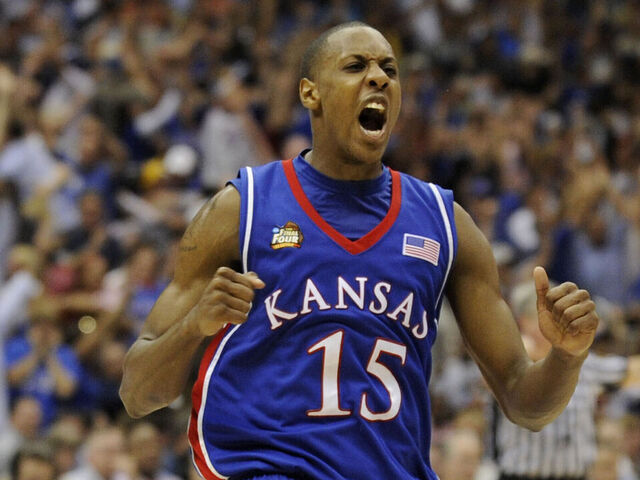 07 APR 2008: Mario Chalmers (15) of the University of Kansas celebrates after hitting a three point basket to send the game into overtime during the Division I Men's Final Four Basketball Championship Game held at the Alamodome in San Antonio, TX. Kansas defeated Memphis 75-68 to claim the championship title. Ryan McKee/NCAA Photos via Getty Images