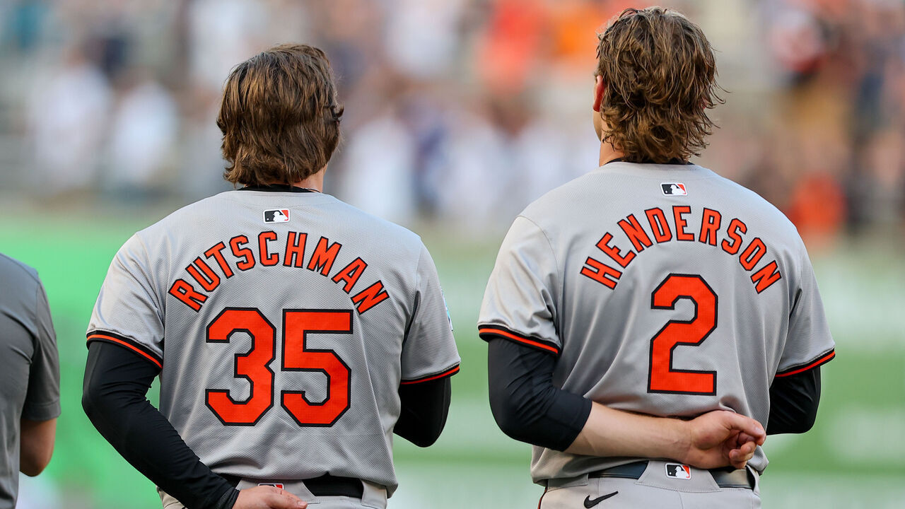 BRONX, NY - JUNE 18: Adley Rutschman #35 of the Baltimore Orioles and Gunnar Henderson #2 during the National Anthem on the field prior to the game against the New York Yankees on June 18, 2024 at Yankee Stadium in Bronx, New York.