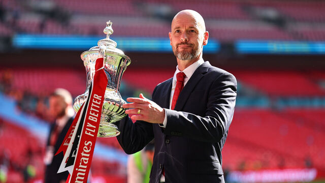 LONDON, ENGLAND - MAY 25: Erik ten Hag the head coach / manager of Manchester United holding the Emirates FA Cup Trophy at full time as Manchester United win the 2024 Emirates FA Cup during the Emirates FA Cup Final match between Manchester City and Manchester United at Wembley Stadium on May 25, 2024 in London, England.