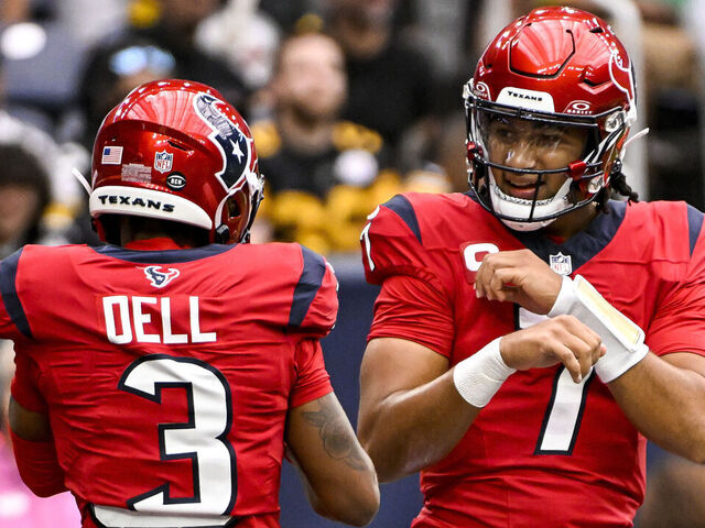 HOUSTON, TEXAS - OCTOBER 01: C.J. Stroud #7 celebrates with Tank Dell #3 of the Houston Texans after defeating the Pittsburgh Steelers at NRG Stadium on October 01, 2023 in Houston, Texas.