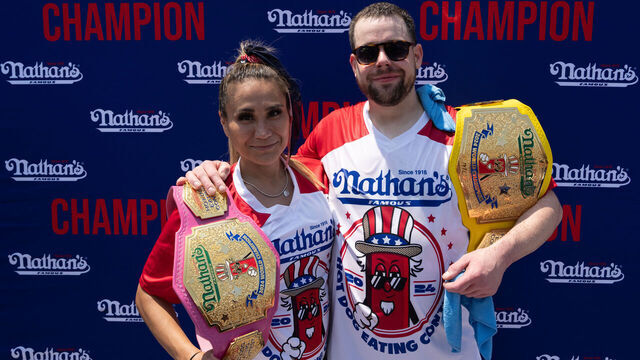 NEW YORK, NEW YORK - JULY 4: Winners Patrick Bertoletti and Miki Sudo pose for a photograph after Nathan's Annual Hot Dog Eating Contest on July 4, 2024 in New York City. Sixteen-time winner Joey Chestnut is banned from this year's contest due to his partnership with Nathan's competitor Impossible Foods, which sells plant-based hot dogs.