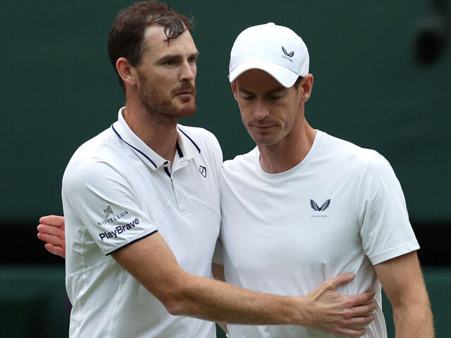 LONDON, ENGLAND - JULY 04: Jamie Murray and Andy Murray of Great Britain embrace following defeat against Rinky Hijikata and John Peers of Australia in the Gentlemen’s Doubles first round match during day four of The Championships Wimbledon 2024 at All England Lawn Tennis and Croquet Club on July 04, 2024 in London, England.
