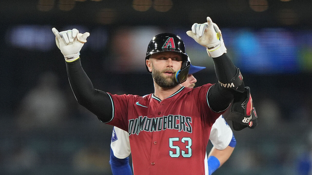 LOS ANGELES, CALIFORNIA - JULY 03: Christian Walker #53 of the Arizona Diamondbacks celebrates on second base after hitting a double against the Los Angeles Dodgers during the sixth inning at Dodger Stadium on July 03, 2024 in Los Angeles, California.