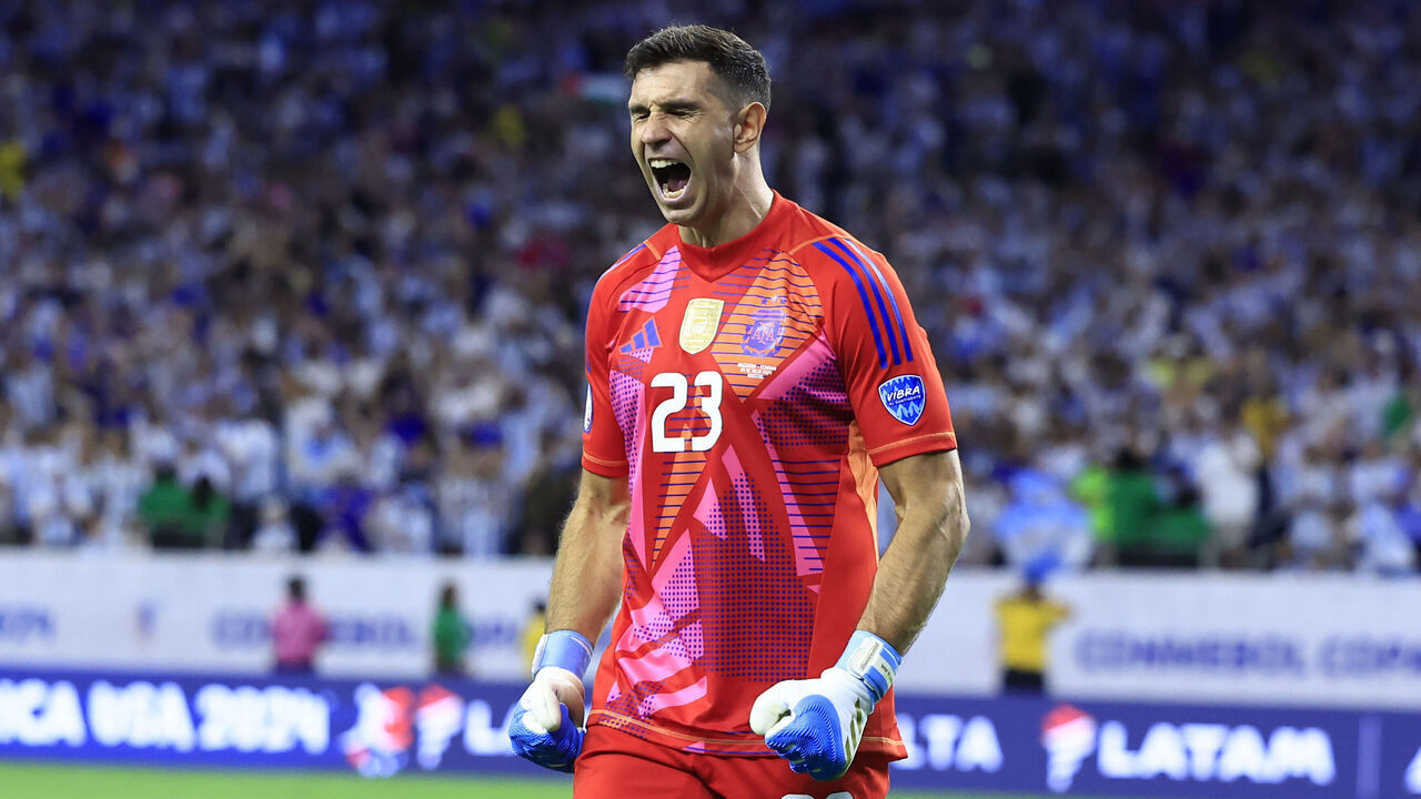 HOUSTON, TEXAS - JULY 04: Emiliano Martinez of Argentina saves the second penalty from Alan Minda of Ecuador (not in frame) in the penalty shoot out during the CONMEBOL Copa America 2024 quarter-final match between Argentina and Ecuador at NRG Stadium on July 04, 2024 in Houston, Texas.