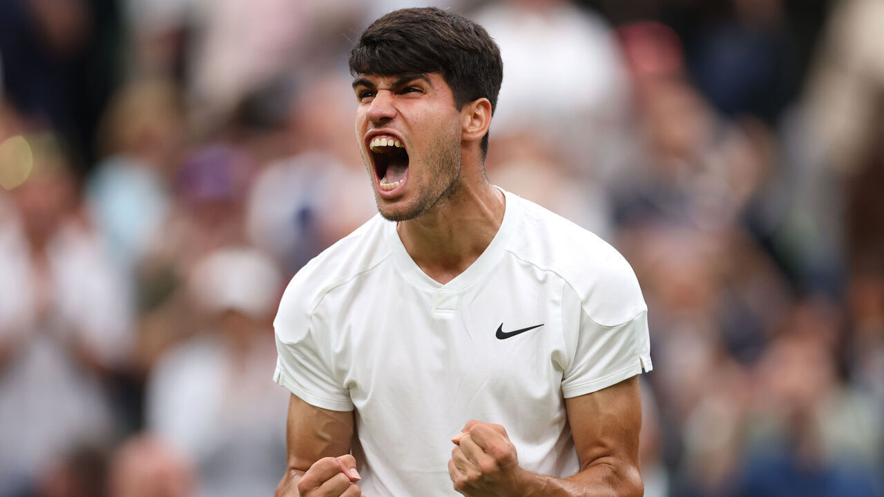 LONDON, ENGLAND - JULY 05: Carlos Alcaraz of Spain celebrates winning match point against Frances Tiafoe of United States in his Gentlemen's Singles third round match during day five of The Championships Wimbledon 2024 at All England Lawn Tennis and Croquet Club on July 05, 2024 in London, England.