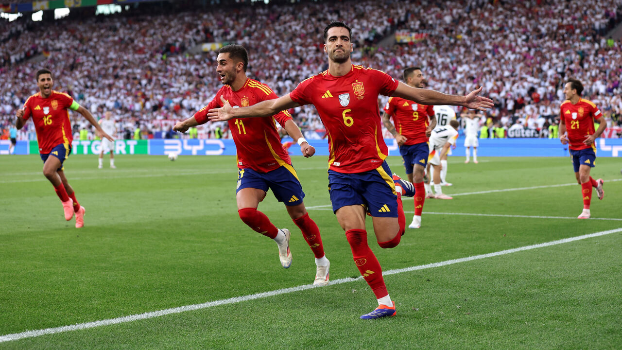STUTTGART, GERMANY - JULY 05: Mikel Merino of Spain celebrates scoring his team's second goal with teammates during the UEFA EURO 2024 quarter-final match between Spain and Germany at Stuttgart Arena on July 05, 2024 in Stuttgart, Germany.