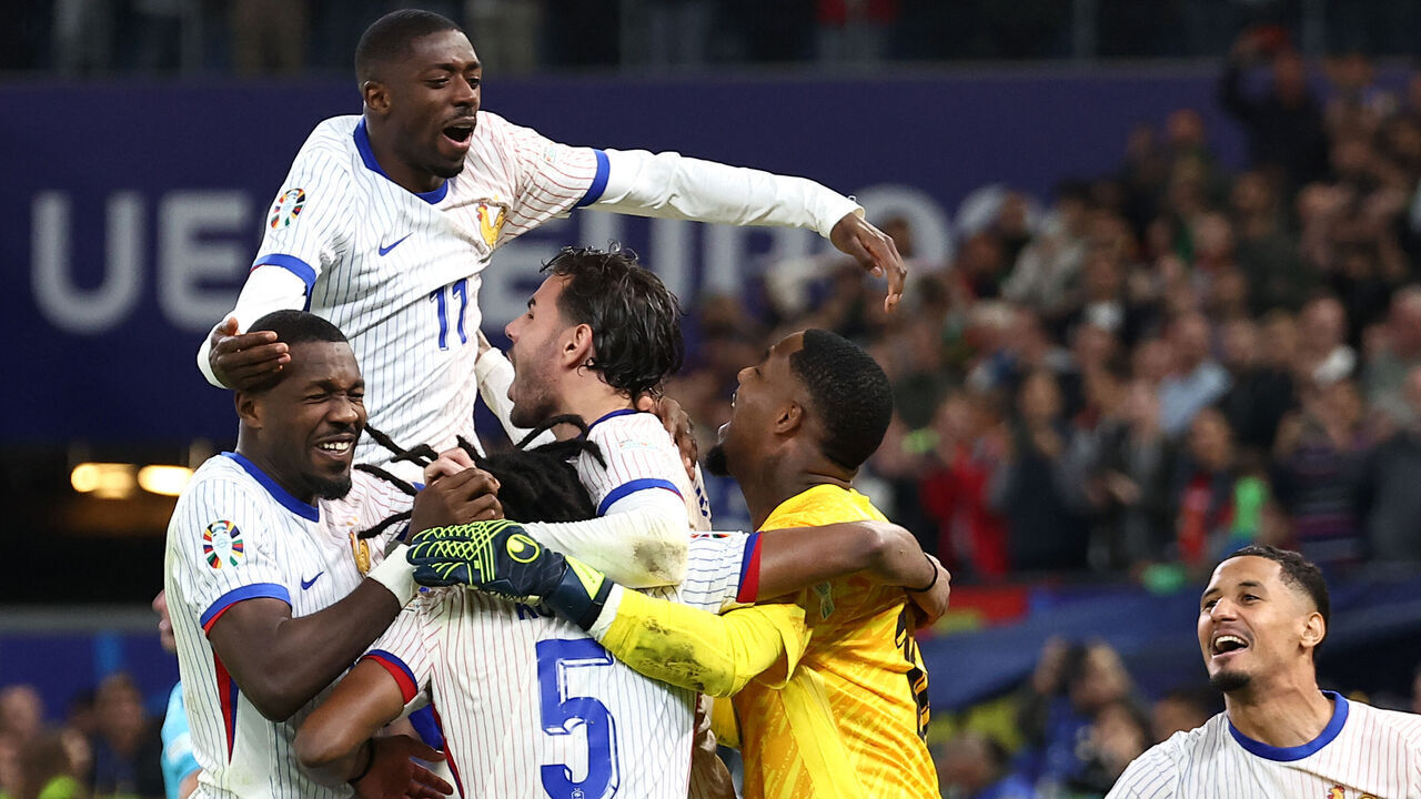 France's players celebrate after winning the UEFA Euro 2024 quarter-final football match between Portugal and France at the Volksparkstadion in Hamburg on July 5, 2024.
