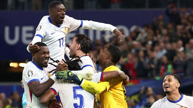 France's players celebrate after winning the UEFA Euro 2024 quarter-final football match between Portugal and France at the Volksparkstadion in Hamburg on July 5, 2024.