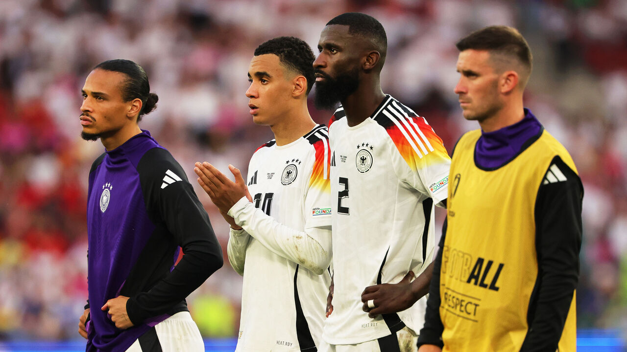 06 July 2024, Baden-Württemberg, Stuttgart: Soccer, UEFA Euro 2024, European Championship, Spain - Germany, final round, quarter-final, Stuttgart Arena, Germany players Leroy Sané (l-r), Jamal Musiala, Antonio Rüdiger and Pascal Groß react after the match. Photo: Christian Charisius/dpa