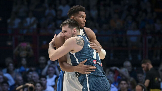 Greece's Giannis Antetokounmpo (L) hugs Slovenia's Luka Doncic prior to the 2024 FIBA Olympic Qualifying Tournament semi-final basketball match between Dominican Republic and Greece at the Peace and Friendship Stadium in Athens, on July 6, 2024.