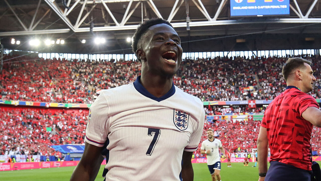 DUSSELDORF, GERMANY - JULY 6: Bukayo Saka of England celebrates their victory in the penalty shoot-out during the UEFA EURO 2024 quarter-final match between England and Switzerland at D¸sseldorf Arena on July 6, 2024 in Dusseldorf, Germany.