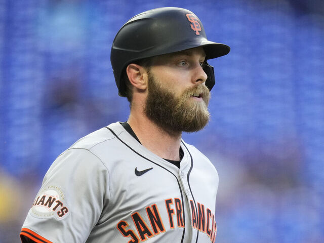 MIAMI, FLORIDA - APRIL 16: Austin Slater #13 of the San Francisco Giants runs to first base during a game against the Miami Marlins at loanDepot park on April 16, 2024 in Miami, Florida.