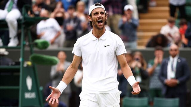 Italy's Lorenzo Musetti celebrates winning against France's Giovanni Mpetshi Perricard during their men's singles tennis match on the eighth day of the 2024 Wimbledon Championships at The All England Lawn Tennis and Croquet Club in Wimbledon, southwest London, on July 8, 2024.