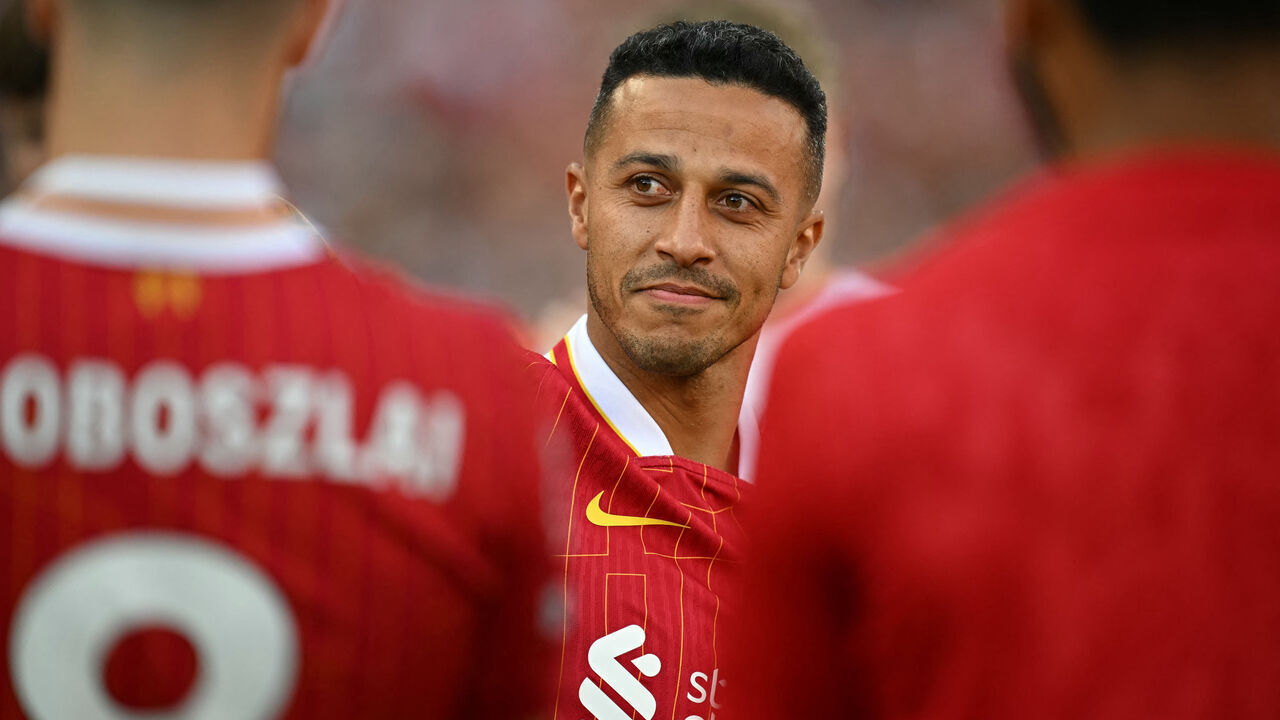 Liverpool's Spanish midfielder #06 Thiago Alcantara says goodbye to the fans after the English Premier League football match between Liverpool and Wolverhampton Wanderers at Anfield in Liverpool, north west England on May 19, 2024.