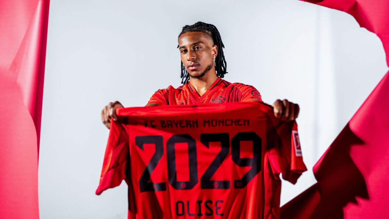MUNICH, GERMANY - JULY 07: Michael Olise poses as he signs a contract with FC Bayern München on July 07, 2024 in Munich, Germany. The 22-year-old forward moves to Munich from English Premier League club Crystal Palace on a five-year contract valid through to 30 June 2029.
