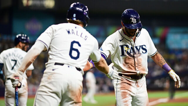 ST PETERSBURG, FLORIDA - JULY 09: Jose Siri #22 of the Tampa Bay Rays celebrates with Taylor Walls #6 after scoring in the eighth inning against the New York Yankees at Tropicana Field on July 09, 2024 in St Petersburg, Florida.