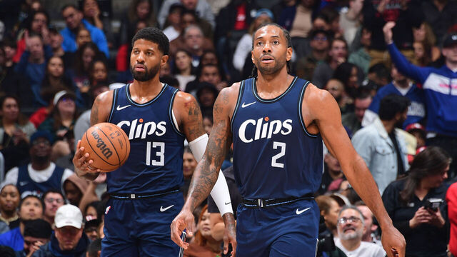 LOS ANGELES, CA - MARCH 1: Paul George #13 and Kawhi Leonard #2 of the LA Clippers looks on during the game against the Washington Wizards on March 1, 2024 at Crypto.Com Arena in Los Angeles, California. NOTE TO USER: User expressly acknowledges and agrees that, by downloading and/or using this Photograph, user is consenting to the terms and conditions of the Getty Images License Agreement. Mandatory Copyright Notice: Copyright 2024 NBAE
