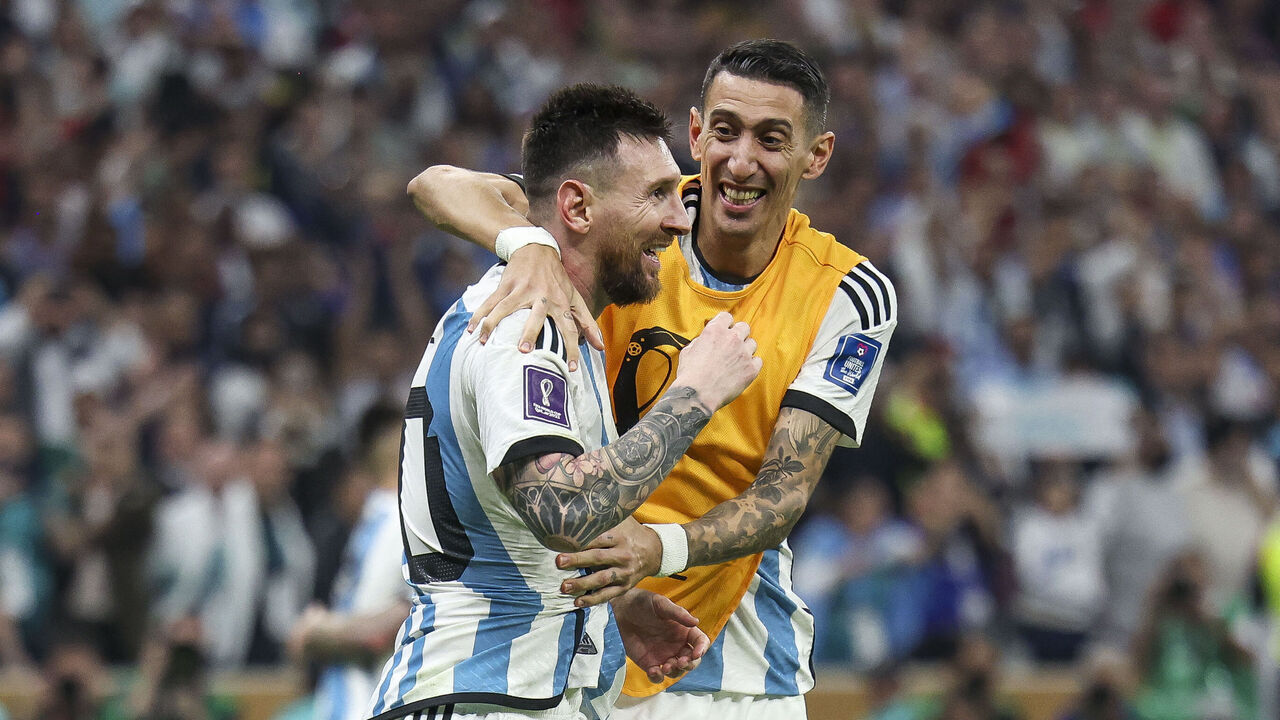 LUSAIL CITY, QATAR - DECEMBER 18: Lionel Messi of Argentina celebrates with Angel Di Maria after scoring their team's third goal p during the FIFA World Cup Qatar 2022 Final match between Argentina and France at Lusail Stadium on December 18, 2022 in Lusail City, Qatar.