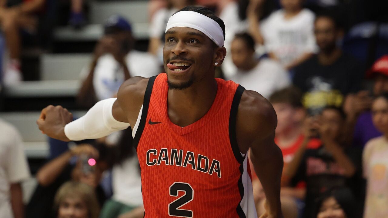 TORONTO, ON- JULY 6 - Shai Gilgeous-Alexander uses a little body English to help a shot into the basket as the Superfan Nav Bhatia hosts a send off for the Men's, Women's, and wheelchair basketball teams representing Canada at the Paris 2024 Summer Olympic Games at Goldring Centre for High Performance Sport in Toronto. July 6, 2024. Steve Russell/Toronto Star (Steve Russell/Toronto Star via Getty Images)