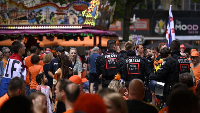 Police patrol as Dutch fans cheer in the streets of Dortmund, western Germany, on July 10, 2024 prior to the UEFA Euro 2024 semi-final football match Netherlands v England played in the city later in the day.