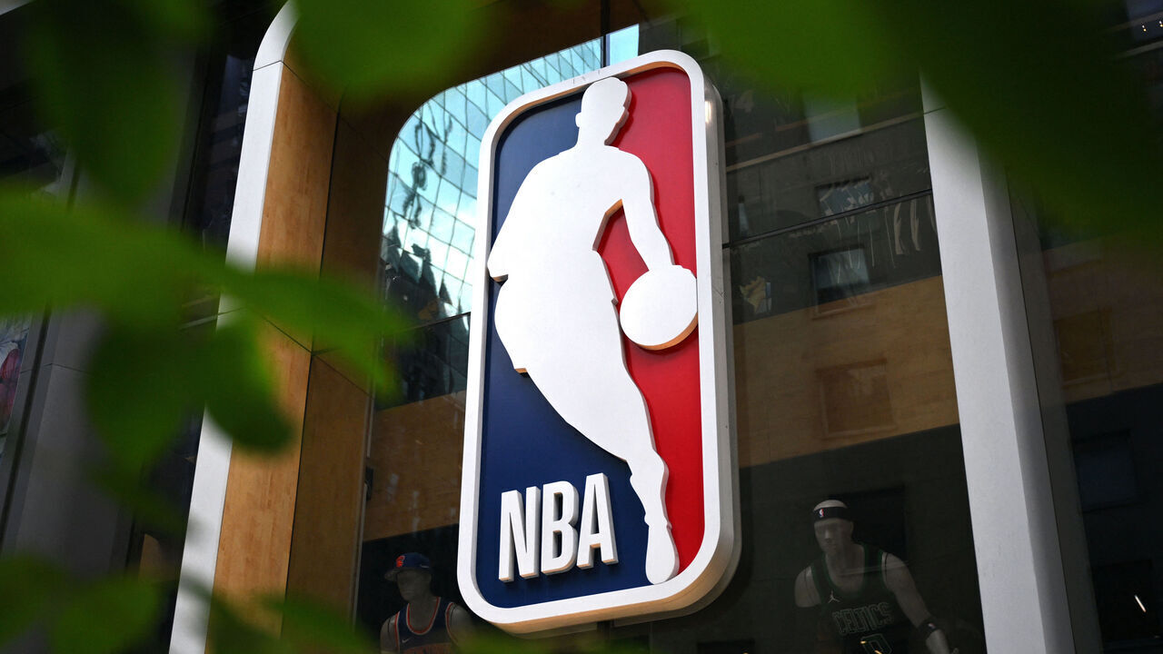 The NBA logo is seen outside an NBA fan store in New York on July 8, 2024.