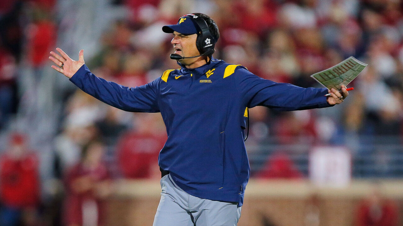 NORMAN, OKLAHOMA - NOVEMBER 11: Head coach Neal Brown of the West Virginia Mountaineers looks for a targeting call against the Oklahoma Sooners after a hard hit on a punt return in the third quarter at Gaylord Family Oklahoma Memorial Stadium on November 11, 2023 in Norman, Oklahoma. Oklahoma won 59-20.