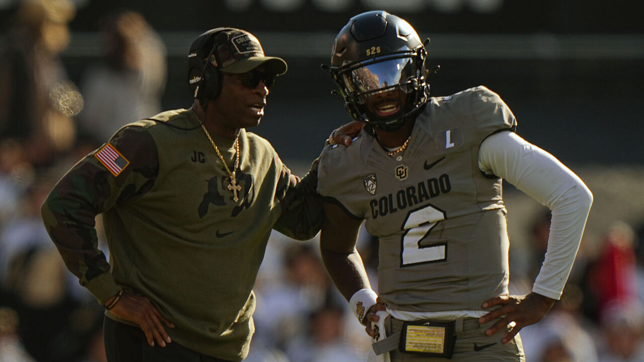 College Football: Colorado head coach Deion Sanders talks with quarterback Shedeur Sanders (2) vs Arizona at Folsom Field. Boulder, CO 11/11/2023 CREDIT: Erick W. Rasco (Set Number: X164462)