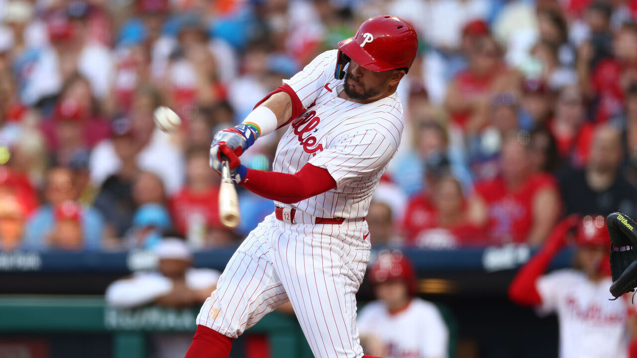 PHILADELPHIA, PENNSYLVANIA - JULY 10: Kyle Schwarber #12 of the Philadelphia Phillies hits a solo home run against the Los Angeles Dodgers in the first inning at Citizens Bank Park on July 10, 2024 in Philadelphia, Pennsylvania.