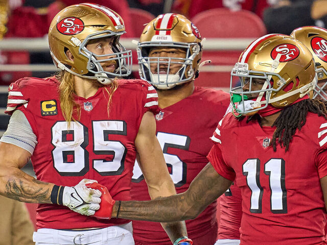 SANTA CLARA, CALIFORNIA - DECEMBER 25: George Kittle #85 and Brandon Aiyuk #11 of the San Francisco 49ers shake hands in action during a game between the San Francisco 49ers and the Baltimore Ravens at Levi's Stadium on December 25, 2023 in Santa Clara, California.