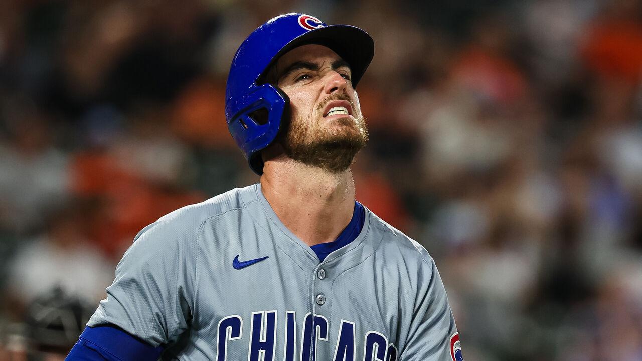 BALTIMORE, MD - JULY 10: Cody Bellinger #24 of the Chicago Cubs reacts after being hit in the hand by a pitch in the seventh inning against the Baltimore Orioles at Oriole Park at Camden Yards on July 10, 2024 in Baltimore, Maryland.