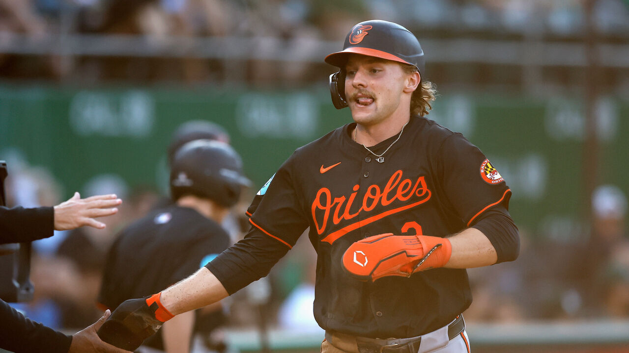 OAKLAND, CALIFORNIA - JULY 05: Gunnar Henderson #2 of the Baltimore Orioles celebrates after scoring on a throwing error by catcher Shea Langeliers #23 of the Oakland Athletics in the top of the first inning at Oakland Coliseum on July 05, 2024 in Oakland, California.