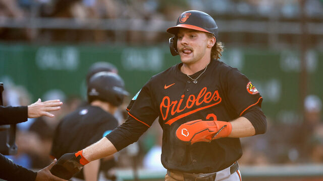 OAKLAND, CALIFORNIA - JULY 05: Gunnar Henderson #2 of the Baltimore Orioles celebrates after scoring on a throwing error by catcher Shea Langeliers #23 of the Oakland Athletics in the top of the first inning at Oakland Coliseum on July 05, 2024 in Oakland, California.