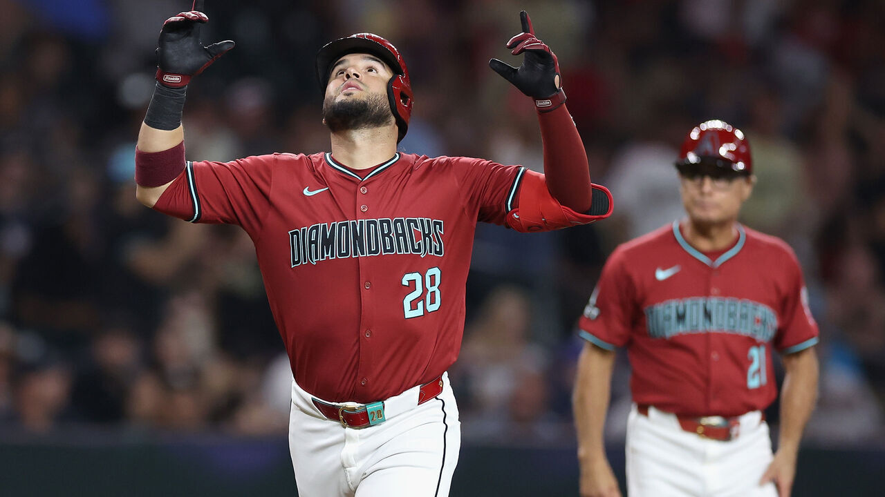 PHOENIX, ARIZONA - JULY 11: Eugenio Suárez #28 of the Arizona Diamondbacks reacts after hitting a solo home run against the Atlanta Braves during the fifth inning of the MLB game at Chase Field on July 11, 2024 in Phoenix, Arizona.