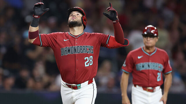 PHOENIX, ARIZONA - JULY 11: Eugenio Suárez #28 of the Arizona Diamondbacks reacts after hitting a solo home run against the Atlanta Braves during the fifth inning of the MLB game at Chase Field on July 11, 2024 in Phoenix, Arizona.