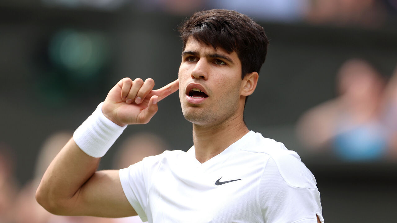 LONDON, ENGLAND - JULY 12: Carlos Alcaraz of Spain celebrates with a gesture to the crowd as he plays against Daniil Medvedev in the Gentlemen's Singles Semi-Final match during day twelve of The Championships Wimbledon 2024 at All England Lawn Tennis and Croquet Club on July 12, 2024 in London, England.