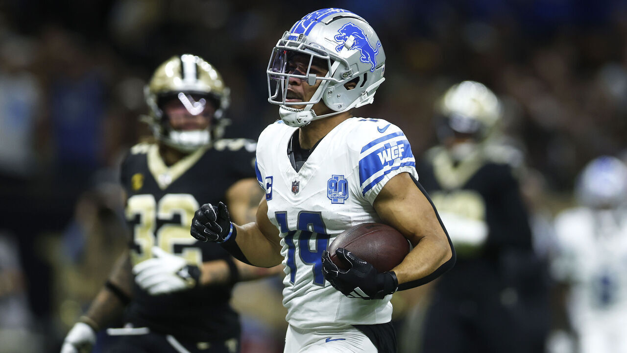 NEW ORLEANS, LOUISIANA - DECEMBER 03: Amon-Ra St. Brown #14 of the Detroit Lions scores a touchdown in the first quarter against the New Orleans Saints at the Caesars Superdome on December 03, 2023 in New Orleans, Louisiana.
