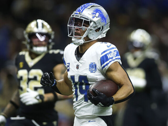 NEW ORLEANS, LOUISIANA - DECEMBER 03: Amon-Ra St. Brown #14 of the Detroit Lions scores a touchdown in the first quarter against the New Orleans Saints at the Caesars Superdome on December 03, 2023 in New Orleans, Louisiana.