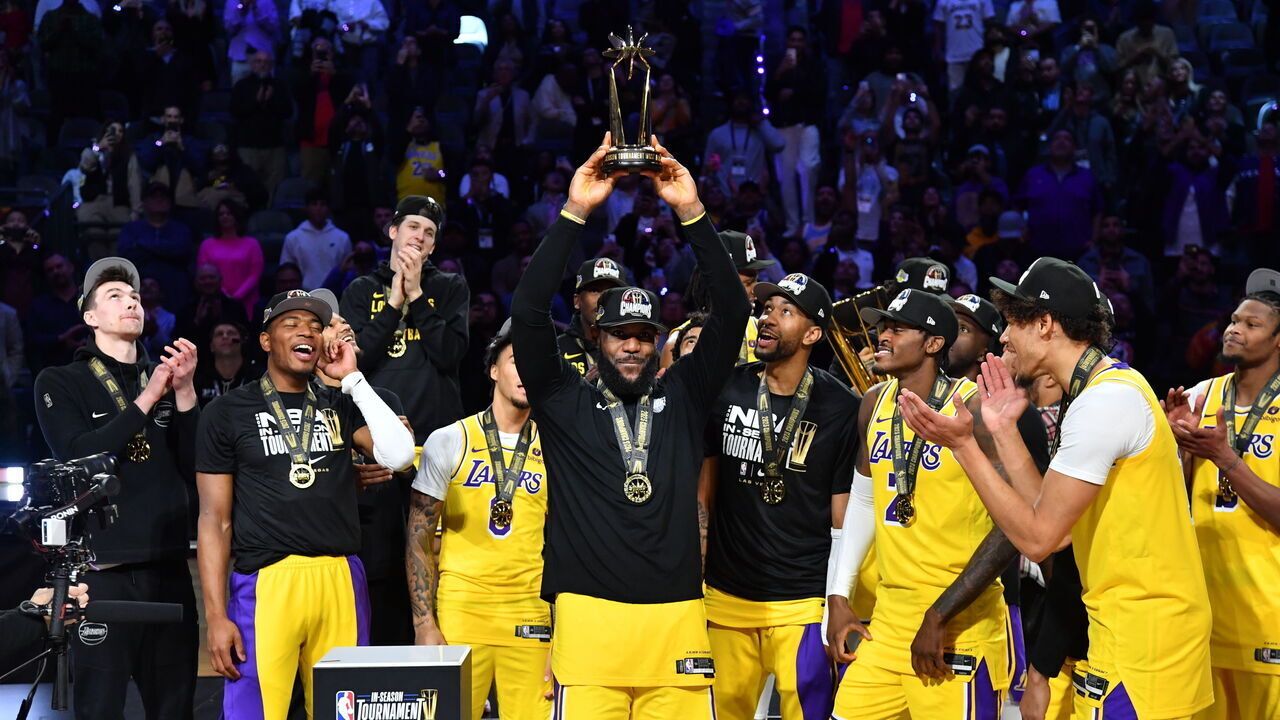 LAS VEGAS, NV - DECEMBER 9: LeBron James #23 of the Los Angeles Lakers celebrates with the In-Season Tournament MVP trophy after winning the In-Season Tournament Championship game against the Indiana Pacers on December 9, 2023 at T-Mobile Arena in Las Vegas, Nevada. Mandatory Copyright Notice: Copyright 2023 NBAE