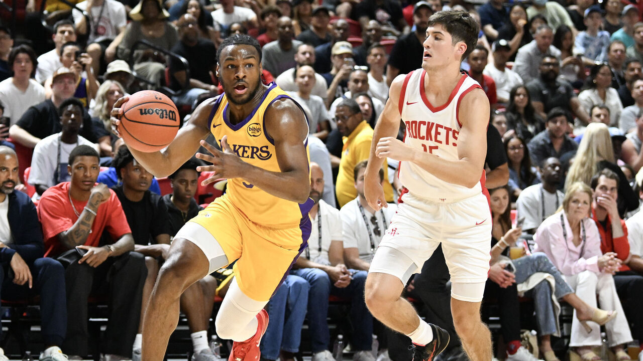 LAS VEGAS, NEVADA - JULY 12: Bronny James Jr. #9 of the Los Angeles Lakers drives past Reed Sheppard #15 of the Houston Rockets in the first half of a 2024 NBA Summer League game at the Thomas & Mack Center on July 12, 2024 in Las Vegas, Nevada.
